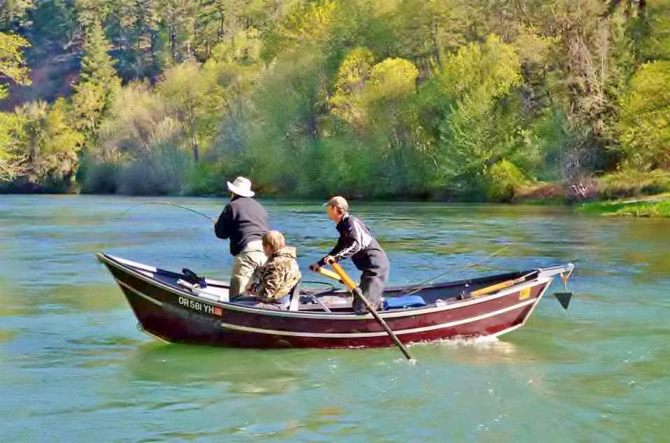 Guided fishing trip from a drift boat on the Rogue river, Oregon. 